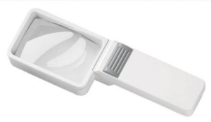 A rectangular handheld magnifying glass with a white plastic body. It has a foldable design with a handle that extends from the main body. The lens is rectangular and slightly convex. There is a gray ridged switch near the hinge, which might be used to activate a built-in light. The design is compact and portable.